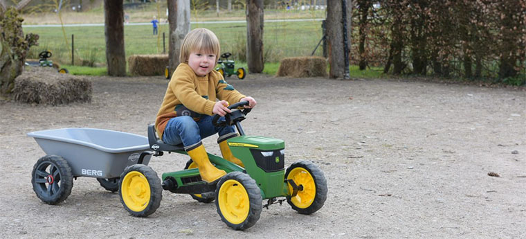 Child on a mini tractor